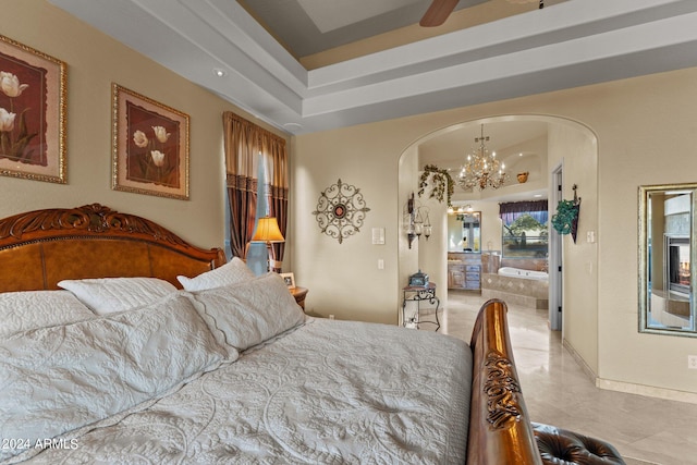 bedroom featuring a chandelier and light tile floors