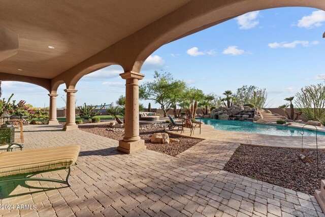 view of patio with pool water feature