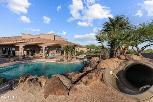 view of swimming pool featuring a patio area