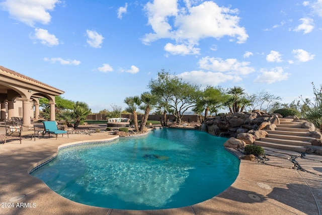 view of pool featuring a patio area