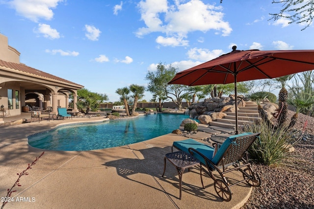 view of swimming pool featuring a patio