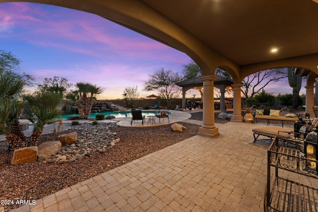 view of patio terrace at dusk