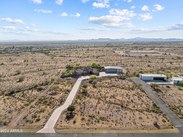 birds eye view of property with a mountain view