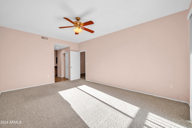 unfurnished bedroom with carpet floors and ceiling fan