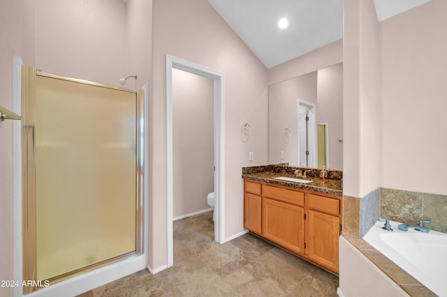 full bathroom with separate shower and tub, vanity, toilet, and vaulted ceiling