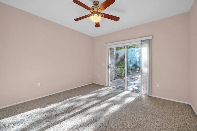 carpeted empty room featuring ceiling fan