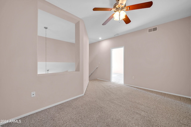 empty room featuring carpet and ceiling fan