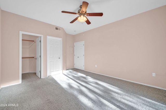 unfurnished bedroom with carpet, ceiling fan, and a closet