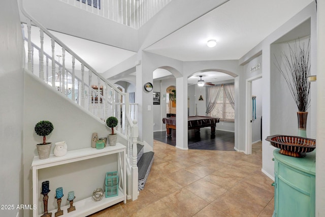 tiled entryway featuring ceiling fan and billiards