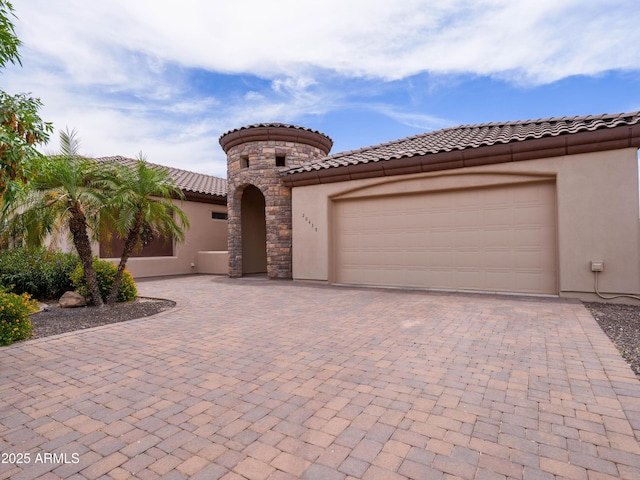 20439 E Palomino Dr, Queen Creek, AZ 85142 - mediterranean / spanish house with stucco siding, decorative driveway, and an attached garage