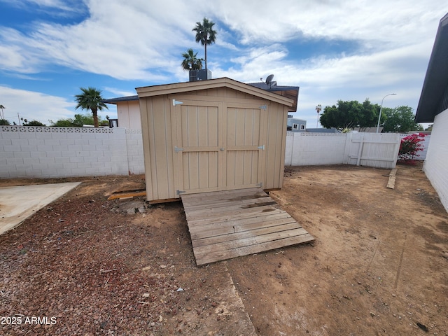 view of shed with a fenced backyard