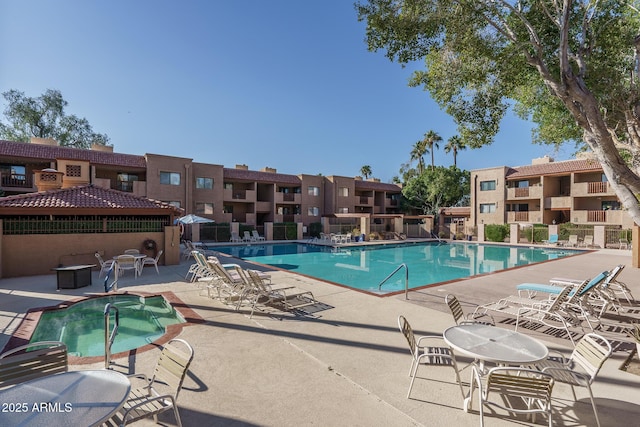 view of swimming pool with a patio