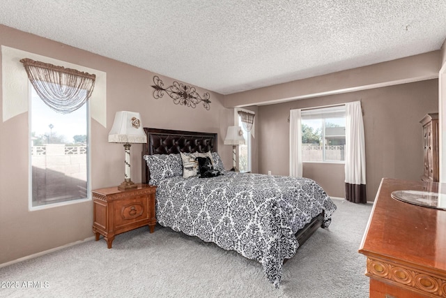 bedroom featuring carpet and a textured ceiling