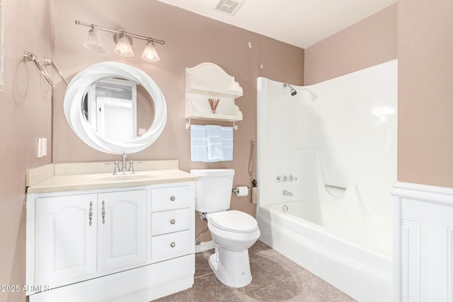 full bathroom featuring vanity, tile patterned flooring, toilet, and washtub / shower combination