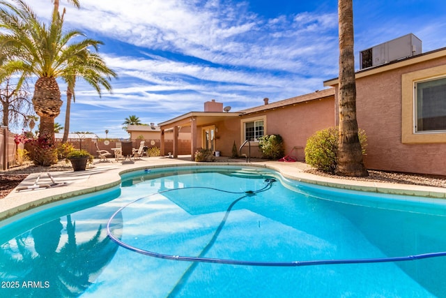 view of swimming pool with a patio area