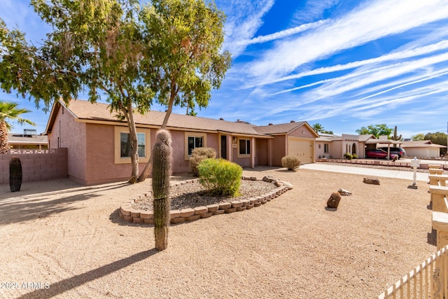 rear view of property featuring a garage