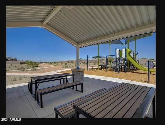 view of patio featuring a playground