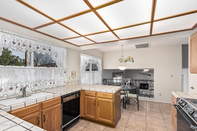 kitchen featuring tile countertops, decorative light fixtures, black dishwasher, kitchen peninsula, and range with electric cooktop