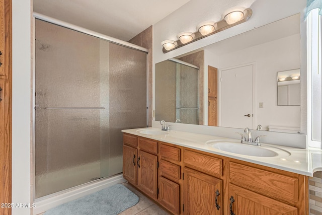 bathroom with vanity, an enclosed shower, and tile patterned flooring