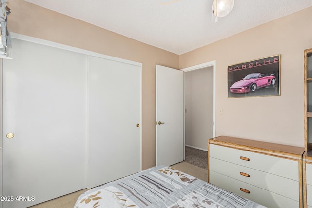 carpeted bedroom with a closet