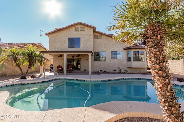 view of pool with a patio and ceiling fan