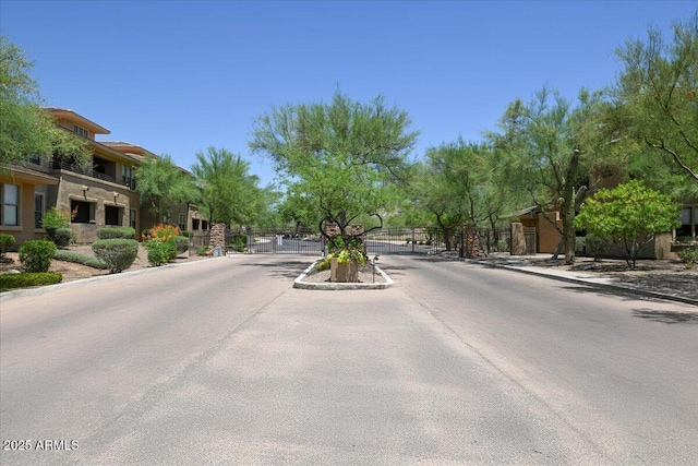 20100 N 78th Pl Unit 2019, Scottsdale, AZ 85255 - view of asphalt street with a gate, curbs, a gated entry, and sidewalks
