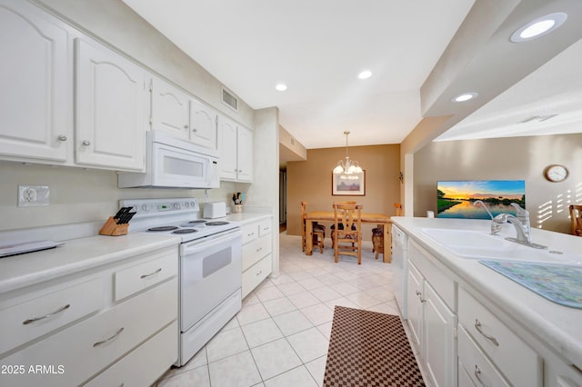 kitchen with sink, white cabinets, decorative light fixtures, white appliances, and light tile patterned floors