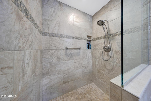 bathroom featuring tiled shower