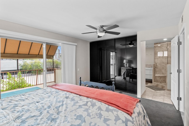 bedroom with light tile patterned flooring, ensuite bath, access to exterior, and ceiling fan