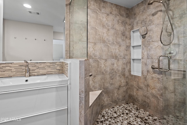 bathroom with a shower with shower door