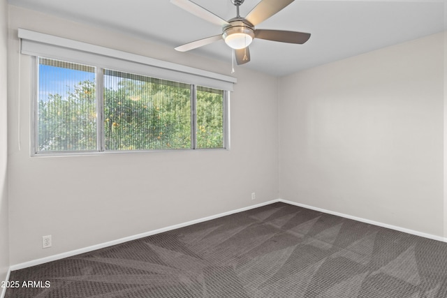 empty room with ceiling fan and carpet