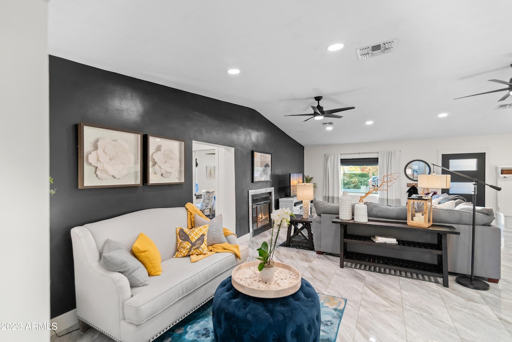 living room featuring lofted ceiling and ceiling fan