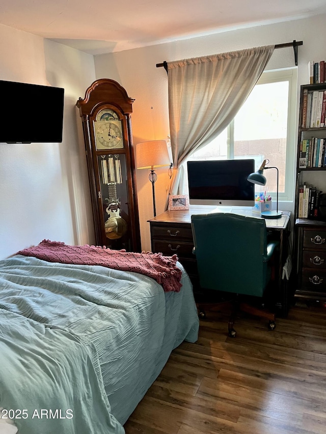 bedroom featuring dark hardwood / wood-style flooring