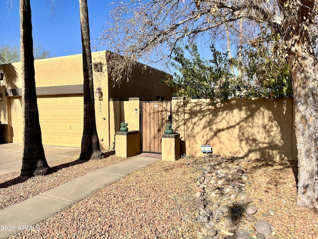 view of property exterior featuring a garage