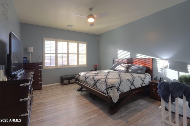 bedroom featuring ceiling fan and light wood-type flooring