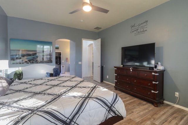 bedroom with ceiling fan and light wood-type flooring