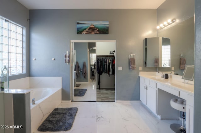 bathroom featuring vanity and a bathing tub