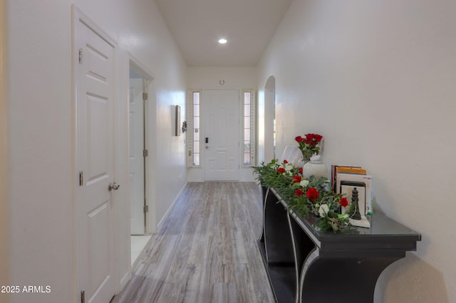 corridor with light hardwood / wood-style flooring