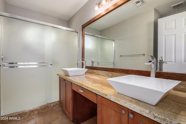 bathroom with vanity and walk in shower