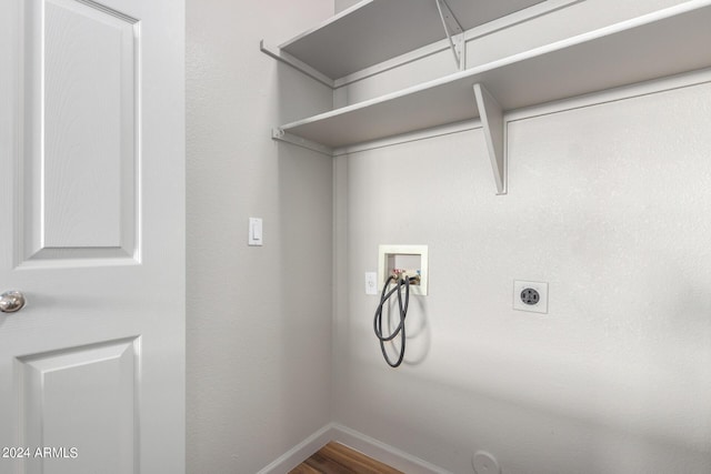 washroom with washer hookup, hardwood / wood-style flooring, and electric dryer hookup