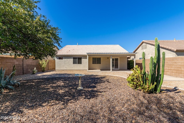 rear view of property featuring a patio area