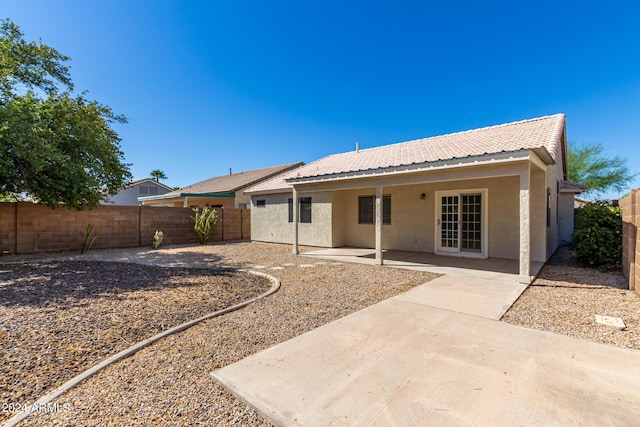 rear view of house with a patio