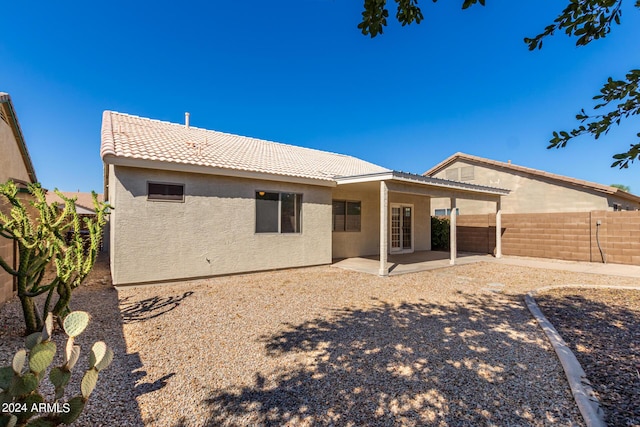 rear view of house featuring a patio