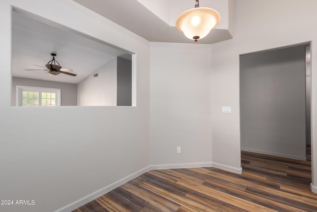 unfurnished room featuring dark hardwood / wood-style flooring and ceiling fan