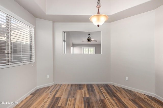 unfurnished room featuring ceiling fan and dark hardwood / wood-style floors