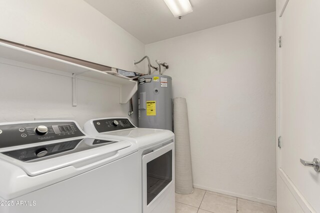 11260 N 92nd St Unit 2102, Scottsdale, AZ 85260 - laundry area with water heater, washer and dryer, and light tile patterned flooring