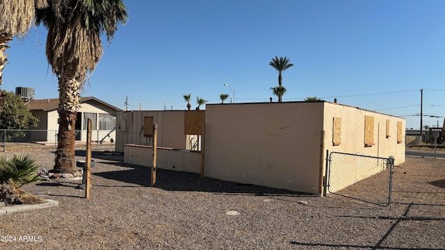 view of side of property with cooling unit