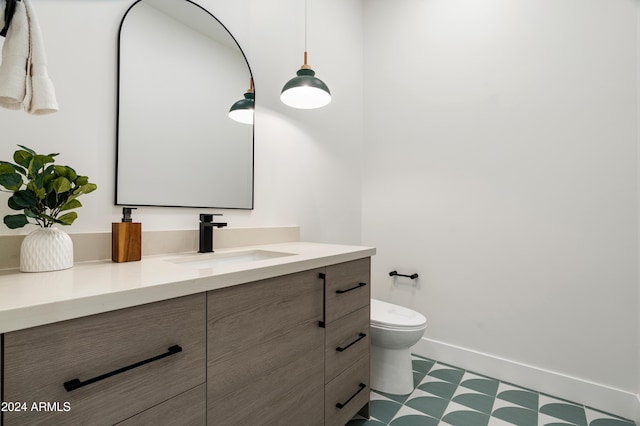 bathroom with vanity and toilet