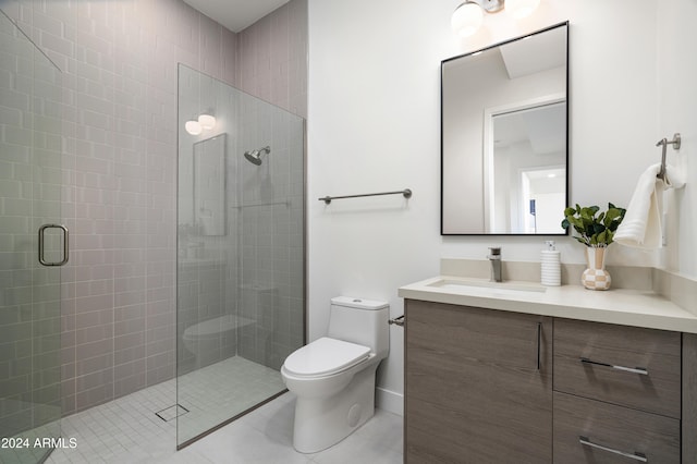 bathroom with tile patterned floors, toilet, vanity, and walk in shower