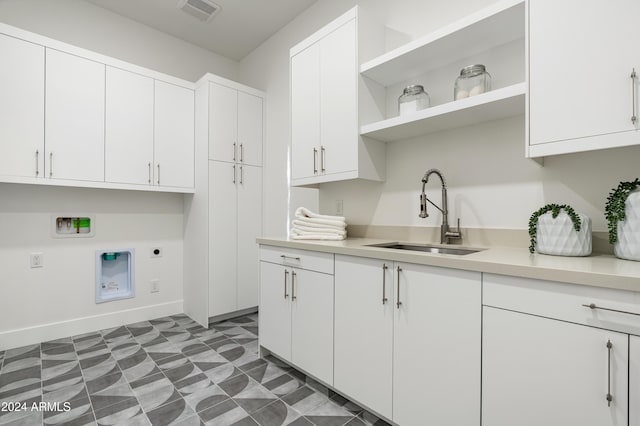 laundry room with washer hookup, sink, cabinets, and hookup for an electric dryer